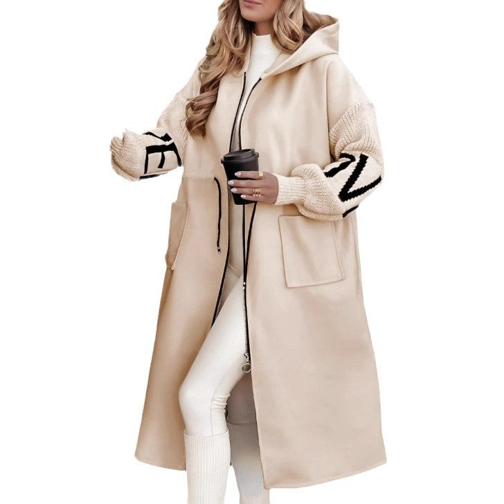 Trench coat with knitted sleeves